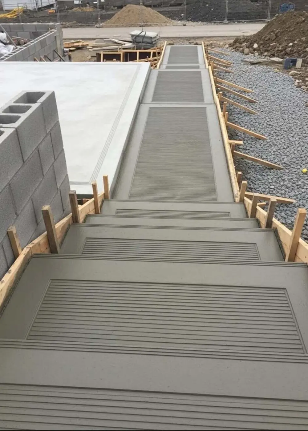 Formed concrete steps and slab pour on a Phoenix AZ job site